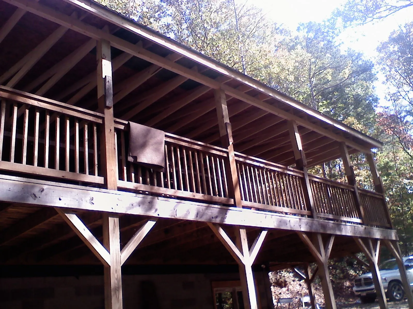 Timber framing under a new elevated porch and deck — Roof Leak Repair in Middlebury Center by Roofing Brothers